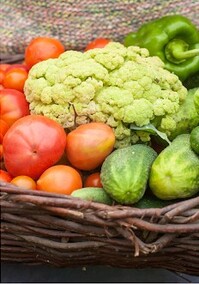 Organic vegetables: Cauliflower, tomatoes, peppers, and cucumbers